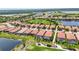 Community overview, showcasing numerous homes and a golf course at 24252 Gallberry Dr, Venice, FL 34293