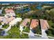 Aerial view of homes near a lake and golf course at 6059 Wingspan Way, Bradenton, FL 34203