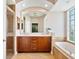 Bathroom with double vanity, soaking tub and glass block window at 6059 Wingspan Way, Bradenton, FL 34203