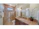 Bathroom with a walk-in shower, granite countertops, and a view into a separate room at 14636 Newtonmore Ln, Lakewood Ranch, FL 34202