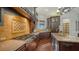 This gourmet kitchen is equipped with a range, granite countertops and beautiful cabinetry at 14636 Newtonmore Ln, Lakewood Ranch, FL 34202