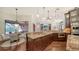 Open kitchen with granite countertops, custom cabinets and views of the breakfast nook and Gathering room at 14636 Newtonmore Ln, Lakewood Ranch, FL 34202