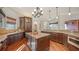 Spacious kitchen with custom cabinets, granite countertops, stainless appliances and center island at 14636 Newtonmore Ln, Lakewood Ranch, FL 34202