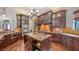 Gourmet kitchen features custom cabinetry, granite countertops, and a large center island at 14636 Newtonmore Ln, Lakewood Ranch, FL 34202