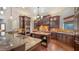 Gourmet kitchen features custom cabinetry, granite countertops, and a large center island at 14636 Newtonmore Ln, Lakewood Ranch, FL 34202