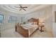 Sun-filled main bedroom features large windows with plantation shutters and a sitting area at 14636 Newtonmore Ln, Lakewood Ranch, FL 34202