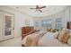 The main bedroom features tray ceilings, plantation shutters and an ensuite bathroom at 14636 Newtonmore Ln, Lakewood Ranch, FL 34202