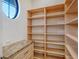 Walk-in pantry features custom shelving and granite countertops at 14636 Newtonmore Ln, Lakewood Ranch, FL 34202