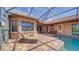 Beautiful screened-in pool and spa area featuring brick pavers and outdoor seating at 14636 Newtonmore Ln, Lakewood Ranch, FL 34202