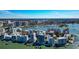 Beautiful condo community shown in an aerial view, with a harbor full of boats and a city skyline at 226 Golden Gate Pt # 64, Sarasota, FL 34236