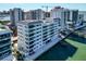 Coastal condo building with stunning waterfront views, modern architecture, and convenient boat access, close to area amenities at 226 Golden Gate Pt # 64, Sarasota, FL 34236