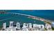 Panoramic aerial shot showcasing waterfront condos near a bridge, blending urban living with scenic beauty at 226 Golden Gate Pt # 64, Sarasota, FL 34236