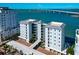 Expansive view of condo building, showcasing its prime location, beautiful bay, and proximity to the bridge at 226 Golden Gate Pt # 64, Sarasota, FL 34236