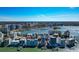 Aerial view of stunning condo community, with a large harbor and city skyline in the background at 226 Golden Gate Pt # 64, Sarasota, FL 34236