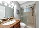 Bathroom features a glass shower, and a granite countertop vanity at 226 Golden Gate Pt # 64, Sarasota, FL 34236
