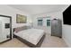Bedroom featuring neutral decor, tiled floors and a large gun safe at 226 Golden Gate Pt # 64, Sarasota, FL 34236