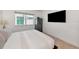 Bedroom featuring neutral decor, tiled floors and a large gun safe at 226 Golden Gate Pt # 64, Sarasota, FL 34236