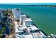 An aerial view featuring luxury bayfront condos with rooftop terraces and waterfront access at 226 Golden Gate Pt # 64, Sarasota, FL 34236