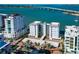 An aerial view of condominium complex featuring a pedestrian bridge and convenient parking at 226 Golden Gate Pt # 64, Sarasota, FL 34236
