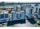 A waterfront condo with private boat docks, surrounded by sparkling blue water and city skyline at 226 Golden Gate Pt # 64, Sarasota, FL 34236