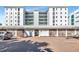 Attractive condo building with manicured landscaping, and brick driveway offering a welcoming entrance at 226 Golden Gate Pt # 64, Sarasota, FL 34236