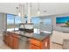 Open concept kitchen with a stainless steel dishwasher, island, and great views of the water at 226 Golden Gate Pt # 64, Sarasota, FL 34236