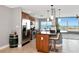 Well-equipped kitchen with stainless steel appliances, granite countertops, a center island, and water views at 226 Golden Gate Pt # 64, Sarasota, FL 34236