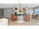Large kitchen with an island, stainless steel appliances, and a breakfast bar, perfect for modern living at 226 Golden Gate Pt # 64, Sarasota, FL 34236