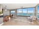 Bright living room with picturesque water views, comfortable seating and stylish decor at 226 Golden Gate Pt # 64, Sarasota, FL 34236