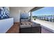 Elegant outdoor patio featuring stylish seating and waterfront views of the dock and bay at 226 Golden Gate Pt # 64, Sarasota, FL 34236