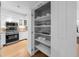 Pantry with adjustable shelving providing ample storage at 988 Blvd Of The Arts # 810, Sarasota, FL 34236