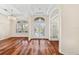 Spacious dining area with hardwood floors and elegant chandelier at 7565 Palmer Glen Cir, Sarasota, FL 34240