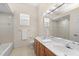 Bright bathroom with double vanity, tub, and shower at 7565 Palmer Glen Cir, Sarasota, FL 34240