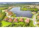 Aerial view of a home located in a community near a lake at 212 Casalino Dr, Nokomis, FL 34275