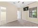 Spacious bedroom with window, ceiling fan, and neutral walls at 212 Casalino Dr, Nokomis, FL 34275