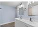 Bathroom with double vanity and modern fixtures at 6912 Kenwood Dr, North Port, FL 34287