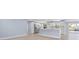 Open concept kitchen with white cabinets and a large island at 6912 Kenwood Dr, North Port, FL 34287