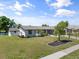 Single story home with a beautifully landscaped yard at 6912 Kenwood Dr, North Port, FL 34287