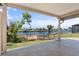 Covered patio overlooking a canal with a private dock at 6912 Kenwood Dr, North Port, FL 34287