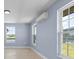Well-lit bedroom with water views and mini-split AC unit at 6912 Kenwood Dr, North Port, FL 34287