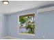 Bedroom with water view and wall mounted AC unit at 6912 Kenwood Dr, North Port, FL 34287