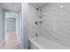 Bathroom with bathtub and marble tile at 6912 Kenwood Dr, North Port, FL 34287