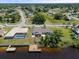 Aerial view showing home, pool and canal access at 6912 Kenwood Dr, North Port, FL 34287
