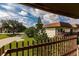 Peaceful balcony view of the community landscape and surrounding buildings at 3384 Ramblewood Ct # B30E3, Sarasota, FL 34237