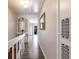 Bright hallway with wood-look floors and access to bedrooms at 3384 Ramblewood Ct # B30E3, Sarasota, FL 34237