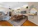 Bright dining room with hardwood floors and a large table at 3871 Alamanda Dr, Sarasota, FL 34238