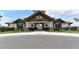 Resort-style community center entrance with stone and wood accents at 14636 Newtonmore Ln, Lakewood Ranch, FL 34202