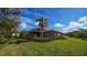Spacious backyard with screened patio, lush landscaping, and privacy at 14636 Newtonmore Ln, Lakewood Ranch, FL 34202