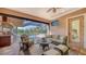 Spacious outdoor living area with comfortable seating and a view of the pool at 14636 Newtonmore Ln, Lakewood Ranch, FL 34202