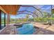 Relaxing pool and spa with screened enclosure, overlooking tranquil preserve views at 14636 Newtonmore Ln, Lakewood Ranch, FL 34202